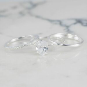 TRIO DE ANILOS SOLITARIO OVALO , LISO Y BANDA CIRCONES